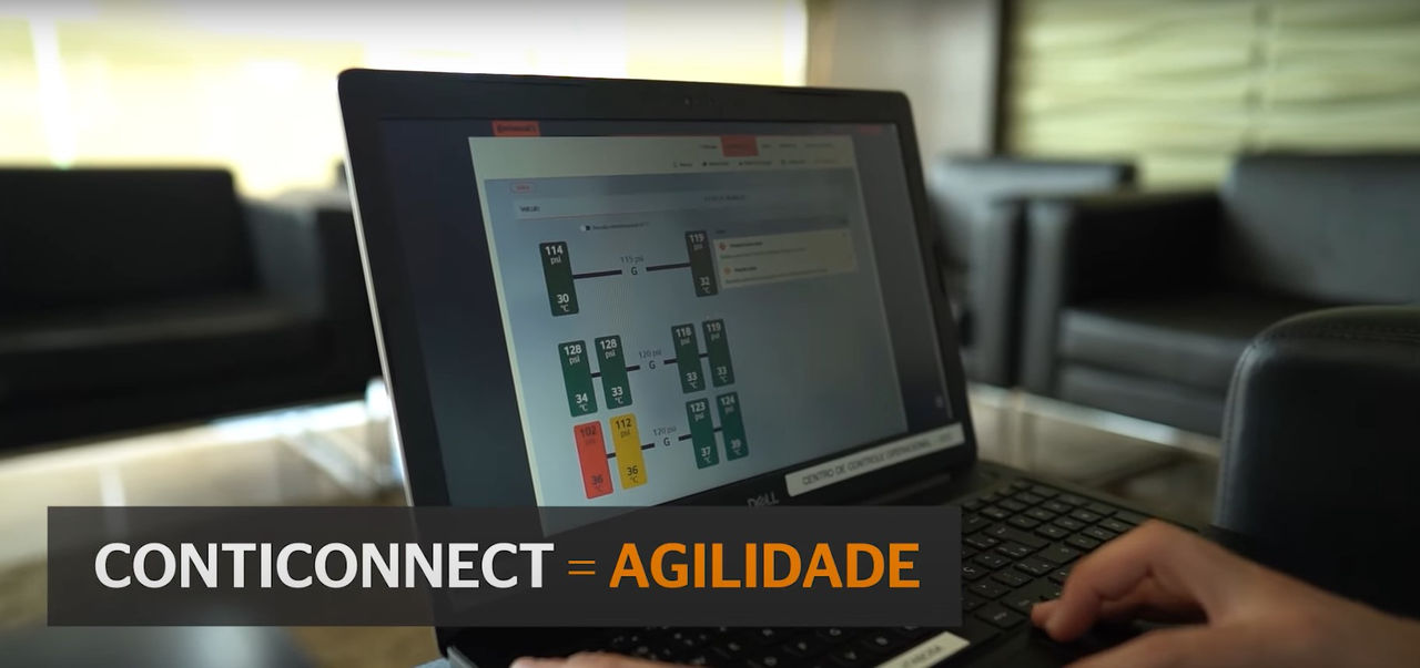 (foto de notebook com tela do sistema ContiConnect)